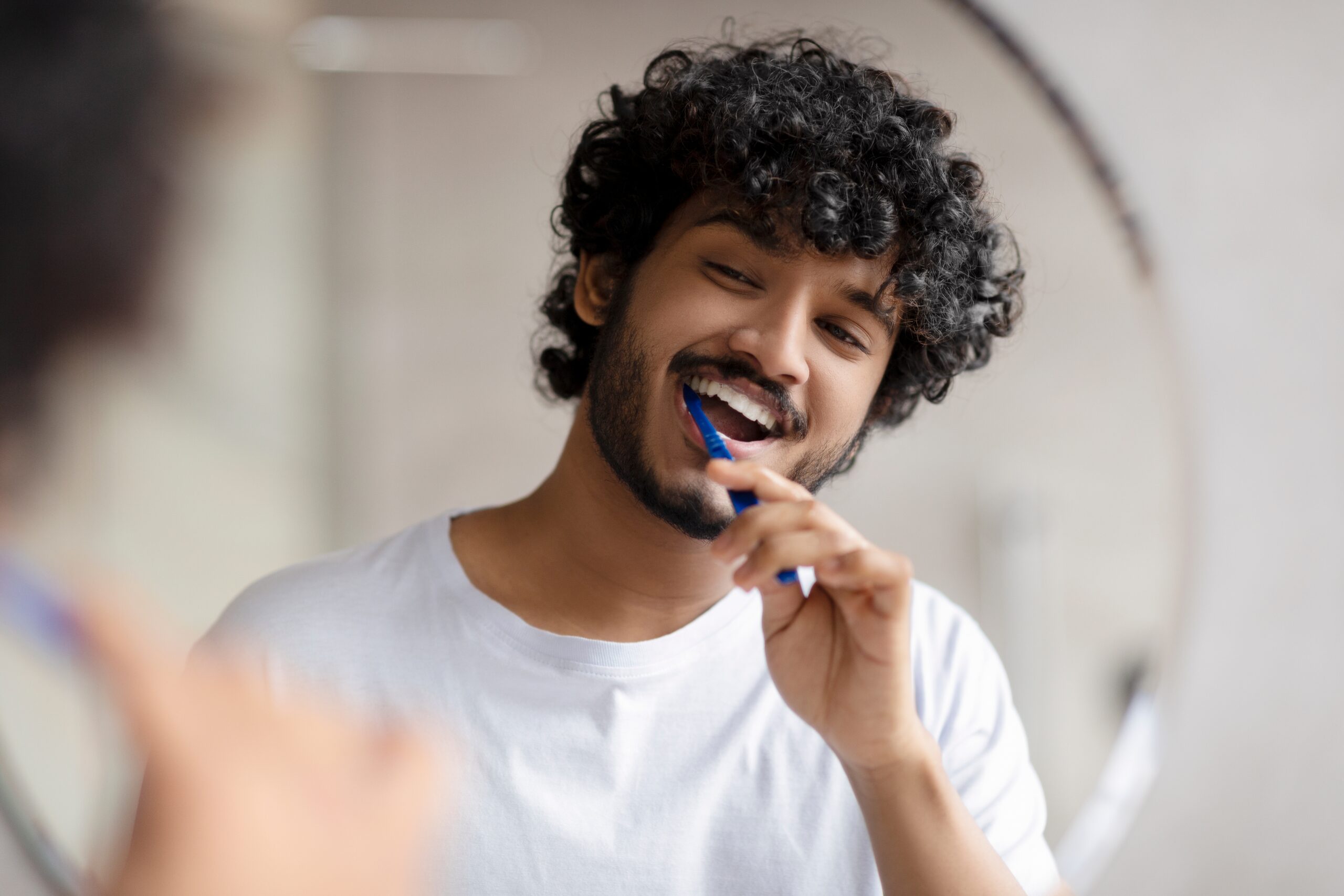 Oral,Care,Concept.,Young,Indian,Man,Cleaning,Teeth,With,Toothbrush,